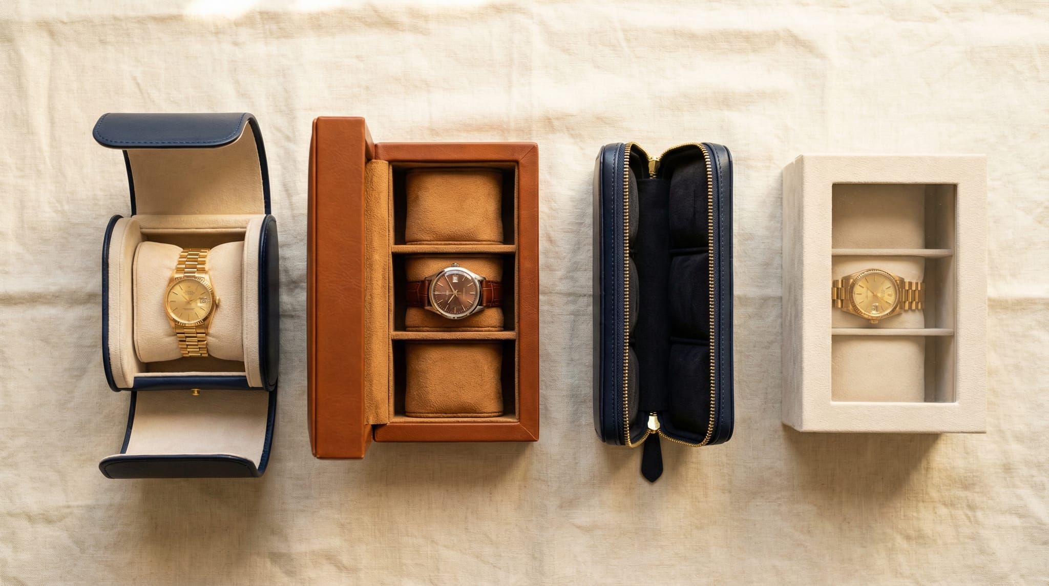 Four custom watch box styles — single presentation box, two-watch collector set, travel case, and display box — in navy and cognac leather on cream linen